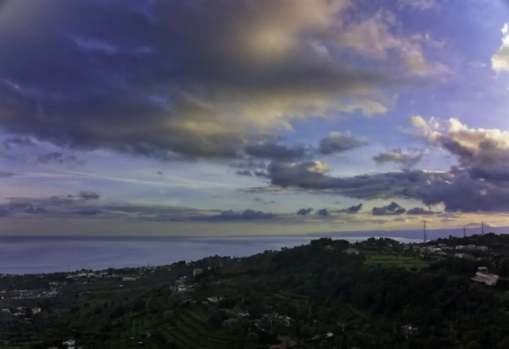 Village on a hill over the Mediterranean sea at sunset. Photo taken with a DJI Mavic 3 by Vicvideopic