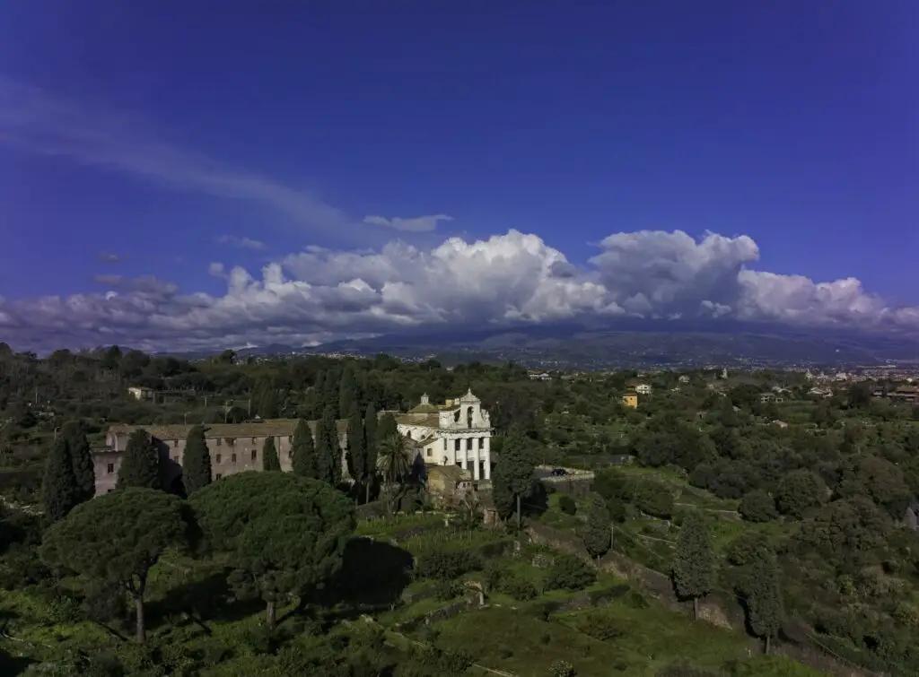 A monastery in Sicily with Mount Etna covered by clouds. Photo taken with a DJI Mavic 3 by Vicvideopic