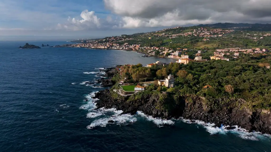 Aerial view over water of the East coast of Sicily near Catania, taken with a drone
