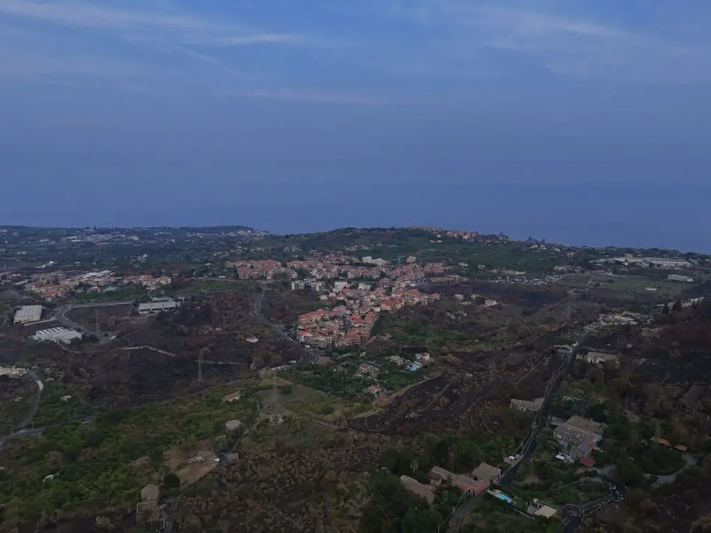 DJI Air 3 wide angle lens: a small village by the sea on the East coast of Sicily