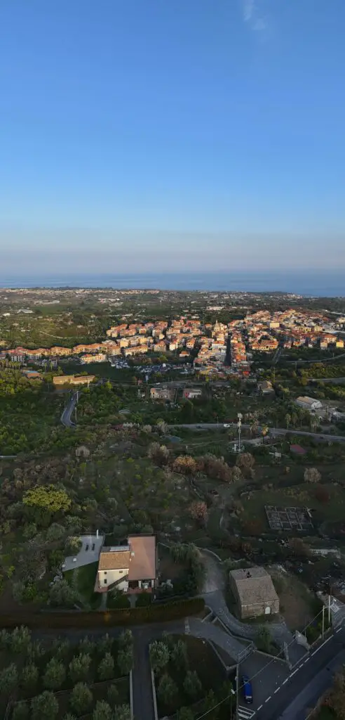DJI Mini 4 Pro: Vertical panorama of a village in the foothills of Mount Etna