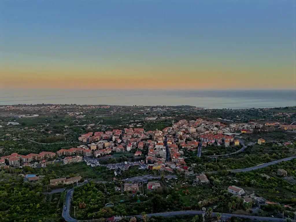 DJI Mini 4 Pro: images merged to HDR of a village with the Mediterranean sea in the background