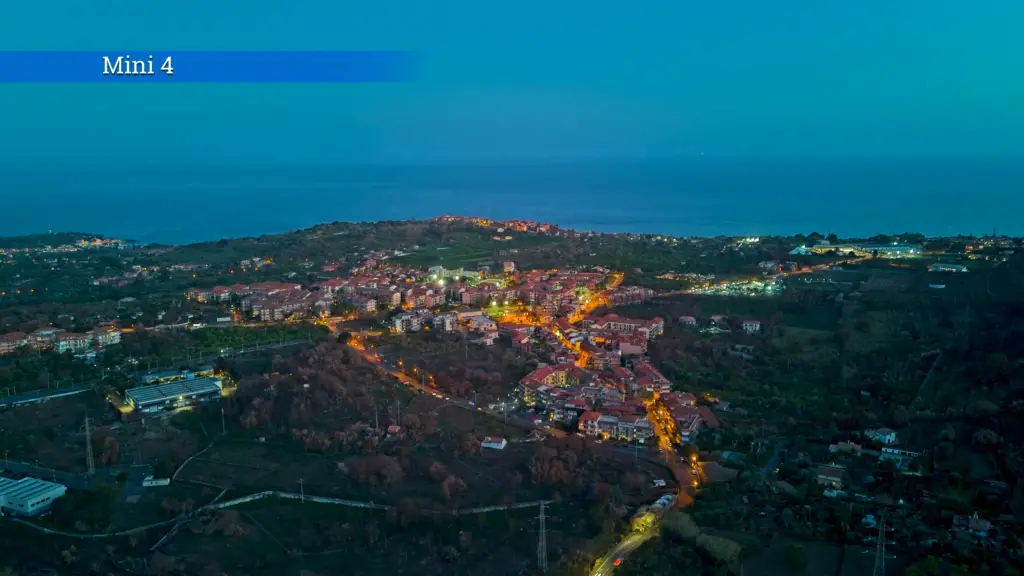 DJI Mini 4 Pro: village by the East coast of Sicily after sunset